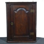 Joined oak hanging corner cupboard, moulded cornice, arched panel door, width 67cm, height 88cm.