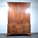 George III mahogany linen press, moulded cornice, two panel doors above two long graduating drawers,