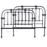 Victorian style double bed, black tubular metal frame with sprung bed base.