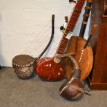 Four large musical instruments, made from gourds.