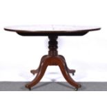 Mahogany breakfast table, circular tilt top, turned column on four curved supports, diameter 118cm,