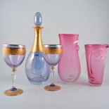 Three pieces of pink art glass, stylised faces, two vases and a jug, signed Blowzone 2002,