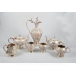 Seven pieces of Indian/ Burmese white metal tea ware, a coffee pot, two teapots,