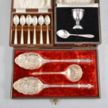 Cased sets of plated flatware to include a pair of berry spoons and sugar sifting spoon, teaspooons,