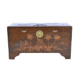 Camphor wood chest, hinged top and front carved with fishing village scenes,W91cm x D44cm x H49cm.