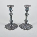 A pair of silver filled candlesticks, square stepped and shaped bases, 19cm high,