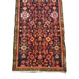 Hamadan runner, all over stylised design, deep mauve ground, narrow geometric borders, 295 x 77cm.