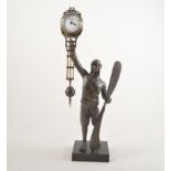 Mystery Aviator clock, patinated art metal, modelled as a male pilot holding a propeller,