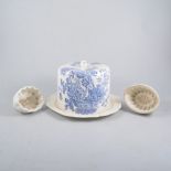 A blue and white stilton cheese dome, and collection of five jelly moulds.