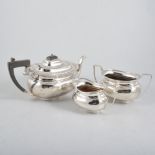 A silver three piece teaset, plain polished oval body with gadroon edge border on a plain oval foot,