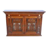 A mahogany two door cabinet with mother-of-pearl inlay,