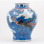 Chinese baluster shaped vase, modern, decorated in a wucai palette with flowering magnolia, 33cm.