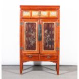 Chinese pine storage cabinet, moulded cornice, the frieze with carved and gilt panels with figures,