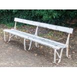 Painted garden bench, wrought iron with wooden slats, length 242cm.
