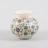 An Indian inlaid alabaster vase, compressed form, floral decoration in hardstone.