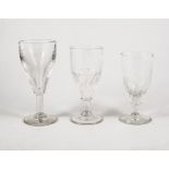 Eleven 19th Century and later stemmed glasses, some half fluted.