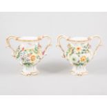 Pair of Coalbrookdale style vases, encrusted floral decoration, 13cm; a tea bowl and saucer,