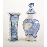 Delft jar, lozenge baluster form, the cover with a bird finial, height 35cm; four Delft vases,