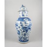 Chinese blue and white baluster shape vase with domed lid, decorated with dragons,