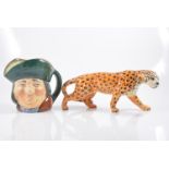 Beswick model of a Leopard, length 31cm; and a large Royal Doulton character jug, Toby Philpots.