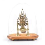 Brass skeleton clock, lancet design, under a glass dome, 39cm overall.