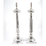 A pair of modern silver-plated column table lamps in the classical style,