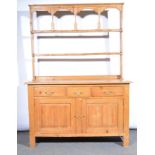 Victorian pine dresser, open rack, the base with rectangular top, three drawers above cupboards,
