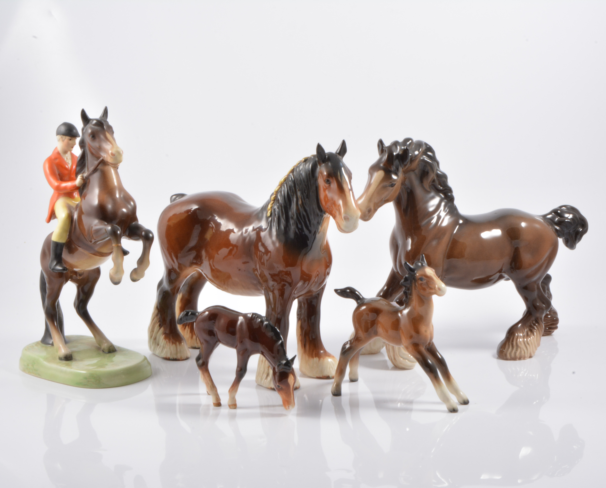 Beswick pottery rearing huntsman; Shire horse, brown; cantering mare and two foals, (5).