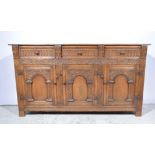 Reproduction oak dresser base, fitted with three drawers over three panelled doors.