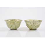 Pair of Chinese Moss Jade bowls, diameter 10cm, with carved hardwood stands and fitted box.