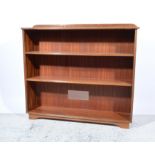 Pair of teak open bookcases, each with two adjustable shelves, width 120cm.