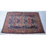 Senneh rug, eagle wing design of a blue field bordered outlines, worn, 170x116cm.