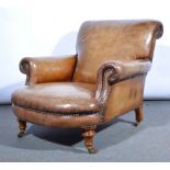 A Gentleman's Edwardian armchair, re-upholstered in brown studded leather,