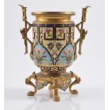 Gilt metal and champ leve enamel garniture vase, raised on four lion paw feet, 20cm.