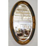 Pair of oval wall mirrors, bevelled plates, carved and gilt frames, 69cm x 43cm.