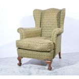 Wing back easy chair, Fleur de Lys pattern upholstery, on cabriole legs, ball and claw feet,