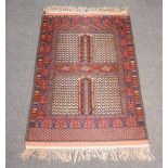 Turkoman silky rug, Hatchli design, with geometric outlines, 169cm x 113cm.