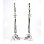 A pair of modern silver-plated column table lamps in the empire style,