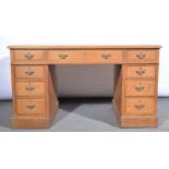 Small twin pedestal desk, fitted with three frieze drawers and three drawers to each pedestal,