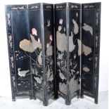 Chinese carved lacqered and painted six-panel folding screen, 20th Century, each panel 41cm x 184cm.