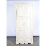 Modern pine painted cupboard, two panelled doors, enclosing shelves, bracket feet, width 91cm.