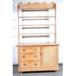 Victorian pine dresser, open three shelf rack, the base with a rectangular top, moulded edge,