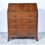 Reproduction mahogany bureau, fall front enclosing a fitted interior, four long drawers below,