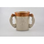 Victorian glazed stoneware large three-handled tankard, applied decoration, 19cm.