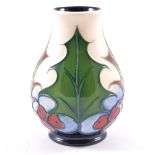 Emma Bossons for Moorcroft Pottery, Holly and Berries, a small vase, 2004, stamped factory marks, 9.