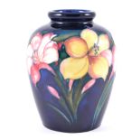 Walter Moorcroft, Freesia, an ovoid vase, circa 1960,initialled in blue, 16cm.