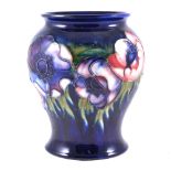 Walter Moorcroft, Anemone, blue ground vase, initialled in blue, 17cm.