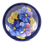 Walter Moorcroft, Clematis, a foot bowl/tazza, circa 1950, initialled in blue, 18cm diam.