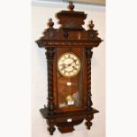 Stained wood Vienna type wall clock, circular dial, the movement striking on a gong, 78cm.