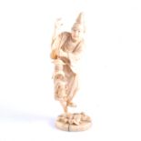 A Japanese carved ivory okimono, a man holding a lantern, Meiji, two character mark, 16cm.